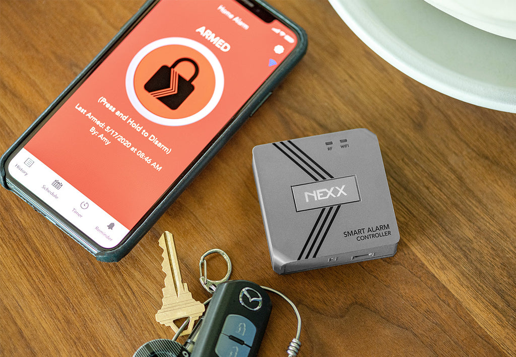 Nexx Smart Alarm NXAL-100 WiFi Nexx Home App Armed Press and Hold to Disarm car keys coffee